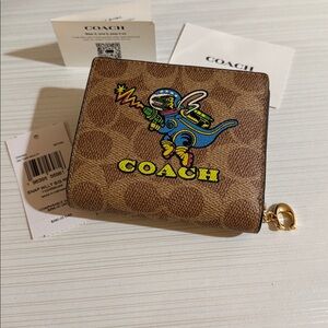 Coach Snap Wallet In Signature Canvas with Rexy Print. $228 msrp